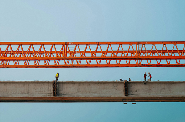 construction workers building bridges